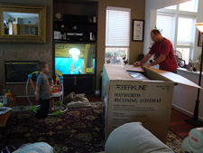 Dave unpacking the couch.