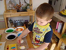 Hunter coloring eggs